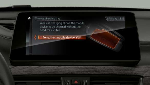 BMW X1, telephony with wireless charging. BMW X1, interior with focus on the Driving Assistant Plus in the displays and controls.