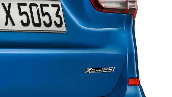 BMW X1, xDrive logo. BMW X1, close-up of the xDrive logo on the rear.