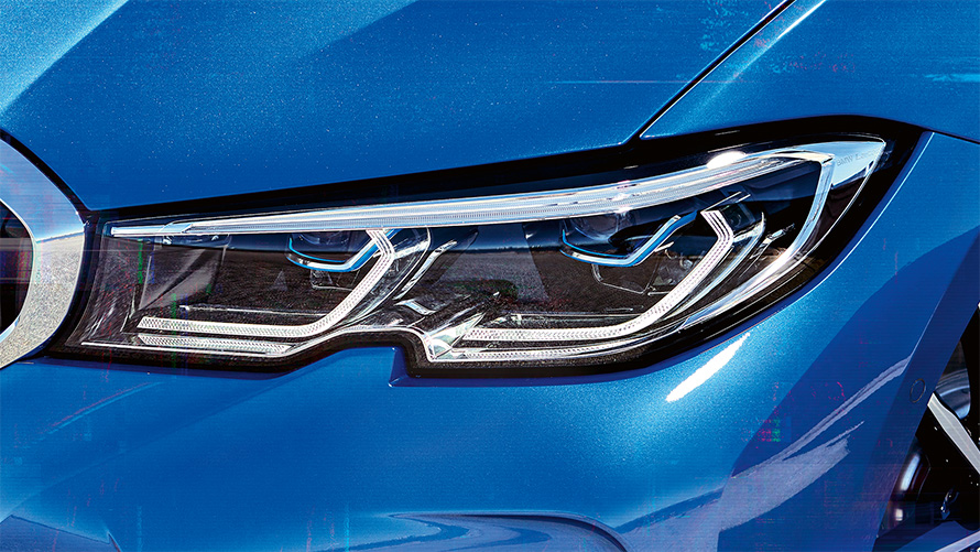 BMW 3 Series Sedan (G20), BMW Laserlight. Lateral close-up of the right front headlights with BMW laserlight.