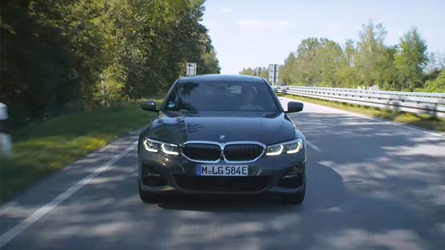 BMW plug-in hybrid driving on the street BMW plug-in hybrid driving on the street front view