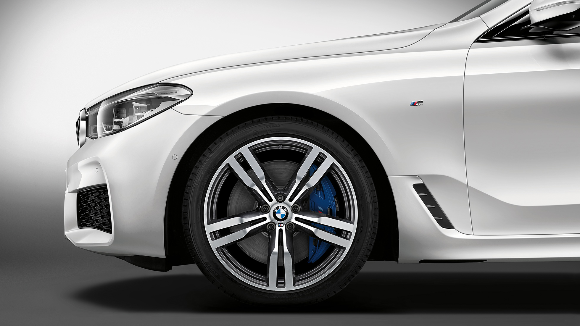 BMW 6 Series Gran Turismo G32 M Sport package lateral front BMW 6 Series Gran Turismo G32 2017 M Sport package Mineral white metallic view lateral front with light alloy wheel Double-spoke style 647 M